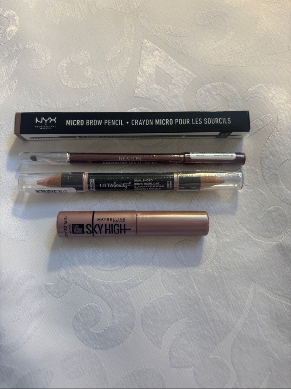 NYX Micro Brow Pencil, Ulta Eyeliner, Revlon multi-liner, Maybeline mascara
